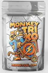 Stříbrný sáček Monkey Triko 100g s barevným logem opice držící štít s bleskem, produkt obsahující prospěšné mikroorganismy pro zlepšení růstu rostlin