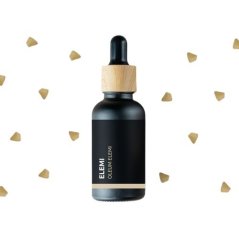Zwarte glazen fles met houten dop en pipet met BIO Elemi essentiële olie op witte achtergrond met gouden confetti